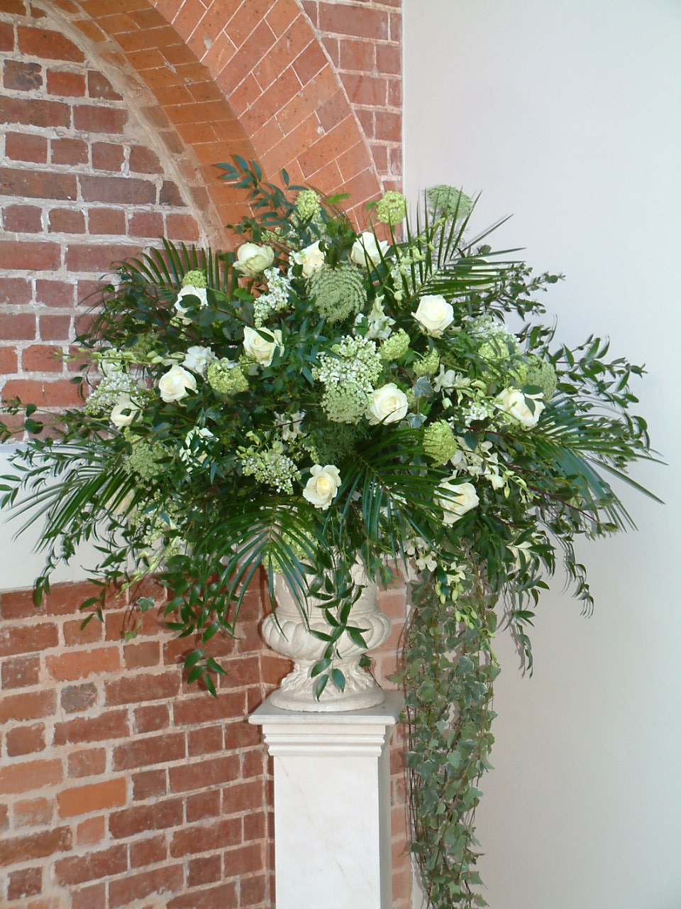 Cream wedding flower urn display